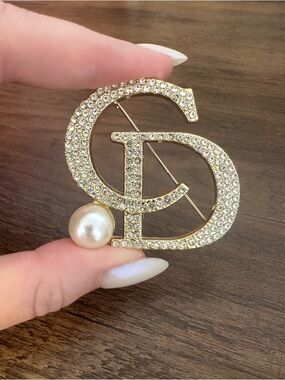 New Gold Crystal Logo-Style Brooch with Pearl Accent